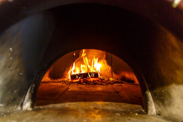Wood burning in the oven for baking pizza.