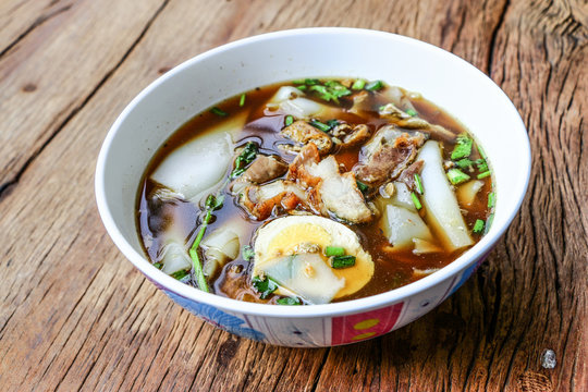 Rice Noodle Soup with pork spare ribs on wooden background