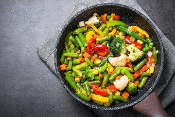 Stir fry vegetables in the wok. Vegan food. - obrazy, fototapety, plakaty
