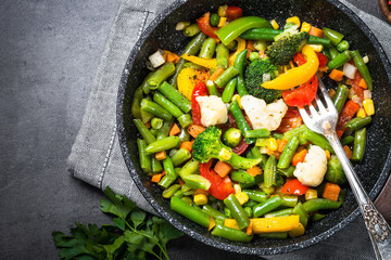 Stir fry vegetables in the wok. Vegan food.