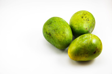 Fresh green mango fruit on white background