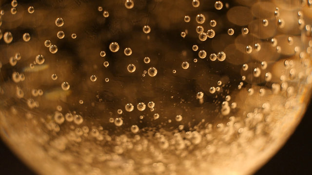 Golden champagne bubbles. background.