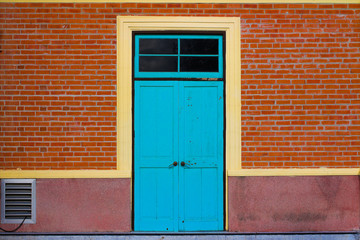 Fototapeta premium Blue windows vintage style with red brick wall
