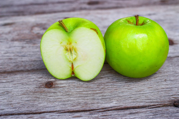 Green apple on wooden background 