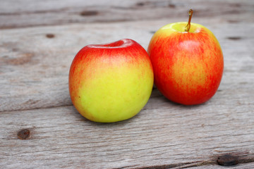 Red apple on wooden background 