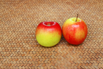 red apple on bamboo background 