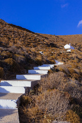 White stairs that lead to a little chapel on the mountain