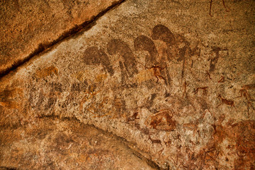Bushmen rock painting of human figures and antelopes, giraffe of the Matopos National Park, Zimbabwe