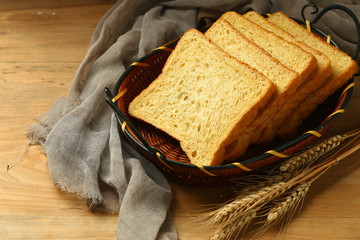 whole wheat bread on wooden table