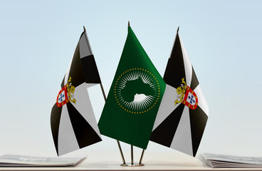 Two flags of Ceuta and African Union flag between