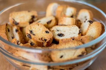 rusks with raisins in  transparent plate; tasty and nutritious food