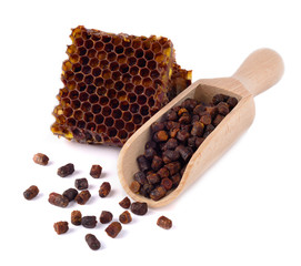 Bee bread granules and a piece of honey cells are isolated on a white background. Natural remedy...