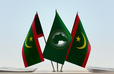 Two flags of Mauritania and African Union flag between