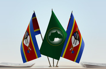 Two flags of Swaziland and African Union flag between