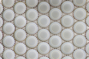 Blurred images, many bottle cap patterns placed together on a wh