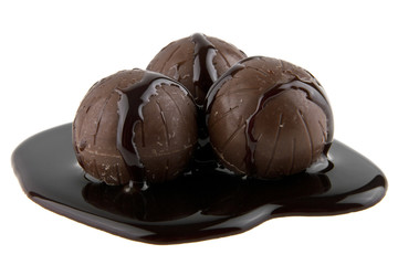 chocolate candy in liquid chocolate isolated on white background