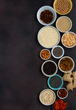 Set vegetarian healthy food - different superfood, seeds and cereal on dark background with copy space, top view. Flat lay. Clean eating concept © kucherav