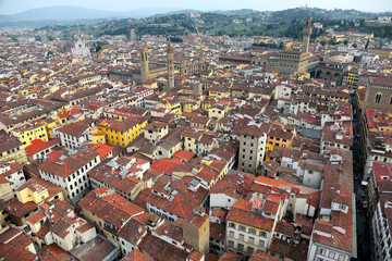 Naklejka na ściany i meble Aerial view of Florence old town from top of Florence Cathedral ( Cathedral of Saint Mary of the Flower ) Panoramic Aerial view from the top of Florence cathedral in Florence Italy ~ 