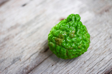 Green bergamot on wooden background 