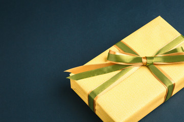 gift on a dark background, top view on a gift box