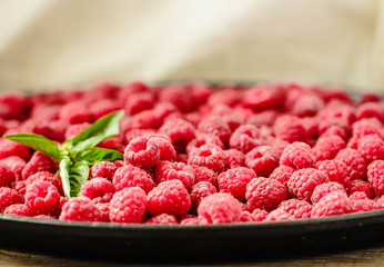 Fresh sweet raspberry and green basil.Selective focus. Horizontally..Detox diet food and raw vegan concept.
