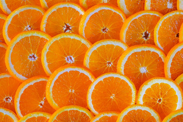 Seamless abstract background of fresh sliced oranges. Close-up view.