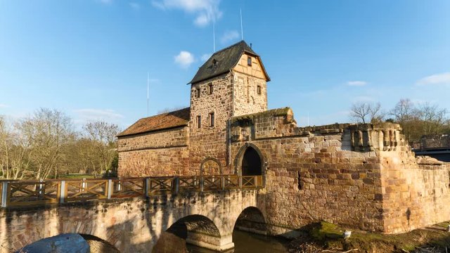 Timelapse - Moving clouds over the water castle of Bad Vilbel, Hesse, Germany