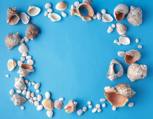 Sea vacation frame with shell on blue
