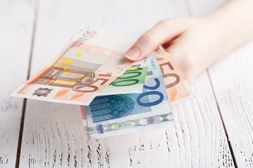 Euro banknotes money in female hands