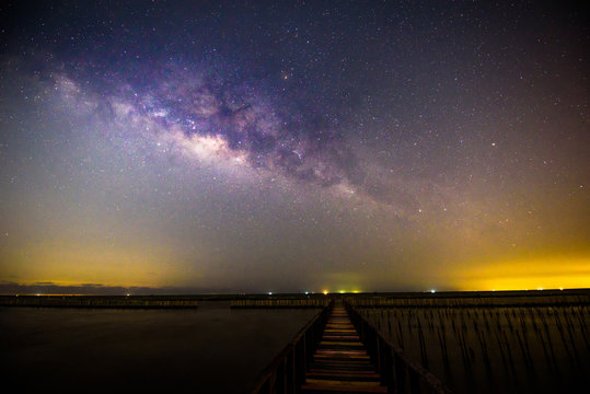milky way at the bridge / Milky way on the sky at sea view