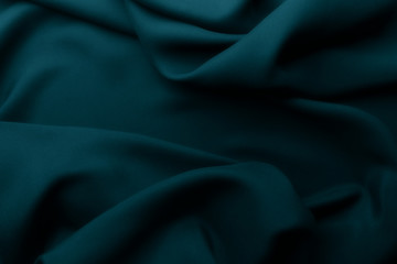 Fototapeta premium Elegant blue satin silk with waves, abstract background.