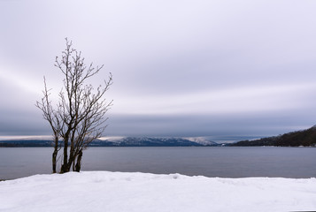 Snow from the east covering Loch Lomond Scotland