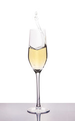 champagne in wineglass on white