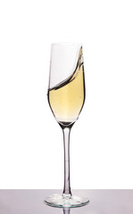 champagne in wineglass on white