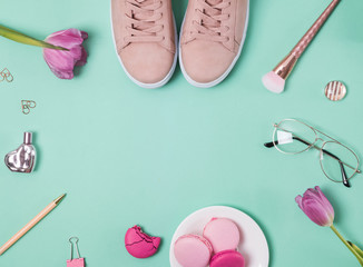 Stylish feminine accessories on the pastel background.