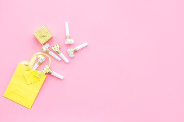 Gift concept. Sweets, paper bag for gift on pink background top view mock up