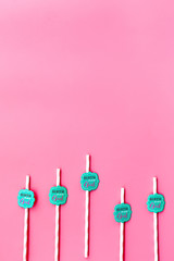 Birthday party background. Lettering Birthday girl on drink straws on pink top view space for text