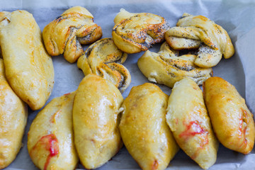 freshly baked homemade village cakes with viburnum and sweet buns with poppy seeds