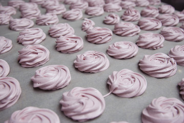 Marshmallow, Meringue, Zephyr over Baking Paper ready for Drying. Pink Dessert with Strawberry. Step by Step process.