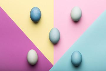 Happy Easter pastel coloured background. Hand painted Easter eggs abstract minimal concept.
