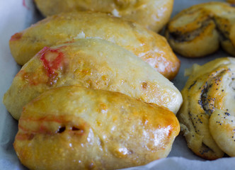 freshly baked homemade village cakes with viburnum and sweet buns with poppy seeds