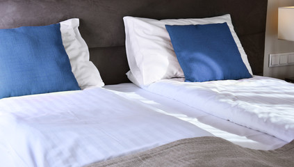 Fototapeta na wymiar Double bed in hotel room. Accommodation