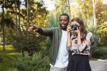 Man teaching his girlfriend photography