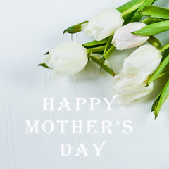 Background, greeting card: bouquet of multicolored tulips on a light background. Layout, mocap, for inscription: "Happy mothers day"
