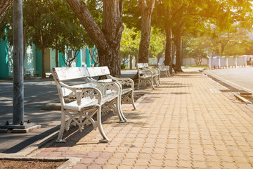 Fototapeta na wymiar Beautiful corner of the bench or armchair in the public park,decoration gardening