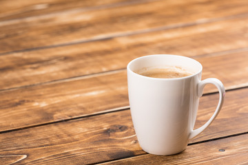 coffee cup on a wooden background