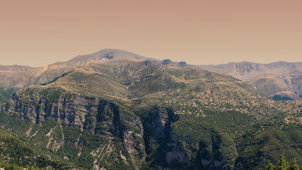 Fototapeta na wymiar Panoramic view of mountain in National Park of Tzoumerka, Greece Epirus region. Mountain in the clouds