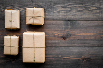 delivery service office with cardboard box for courier on wooden background top view mock-up