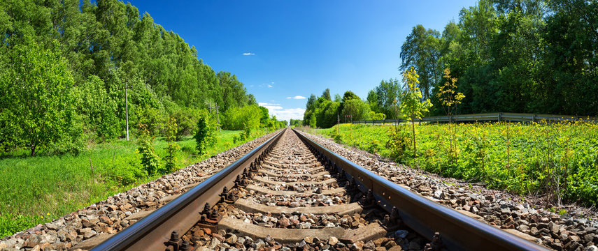 Railway outdoors on beautiful summer day. Landscape with railroad