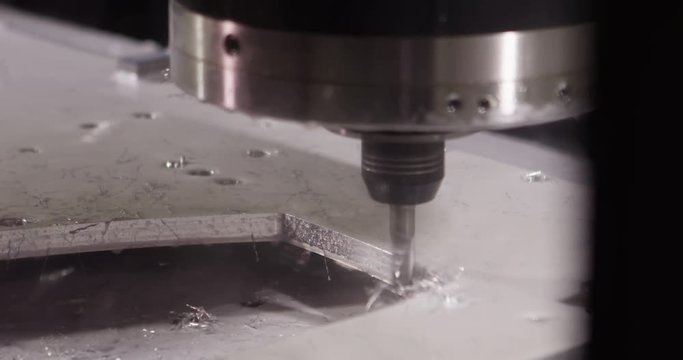 Close-up of a water jet metal cutting machine in slow motion